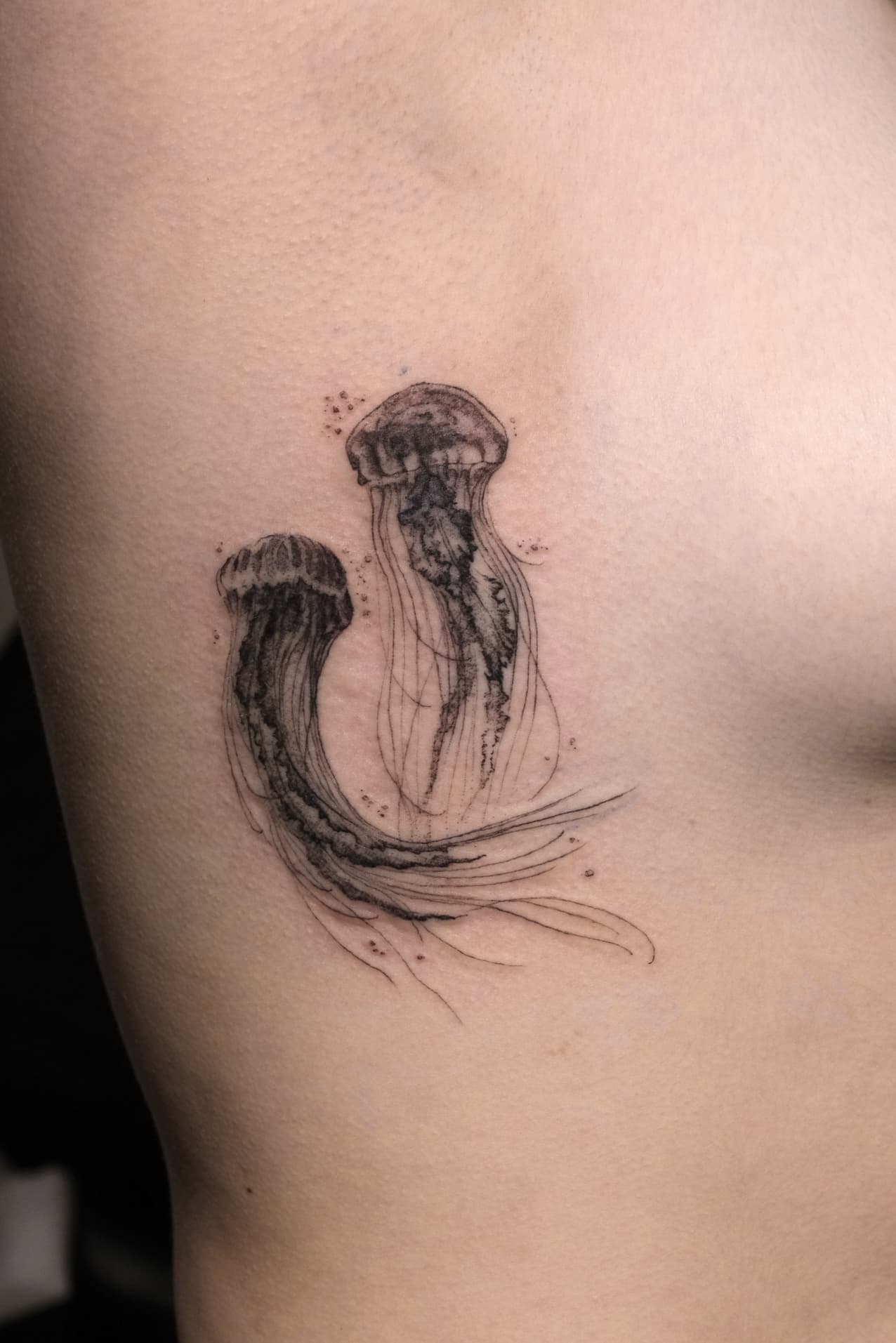 Jellyfish rib tattoo