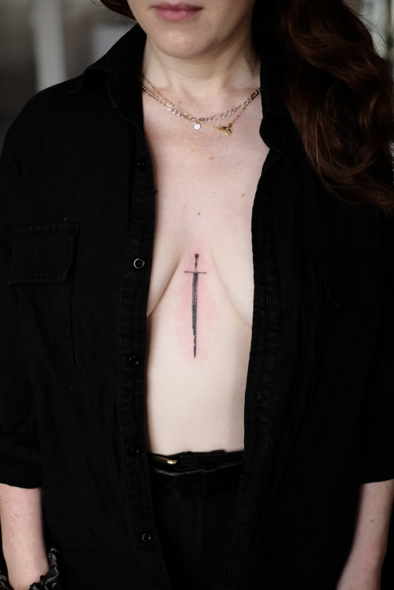 Sternum dagger tattoo